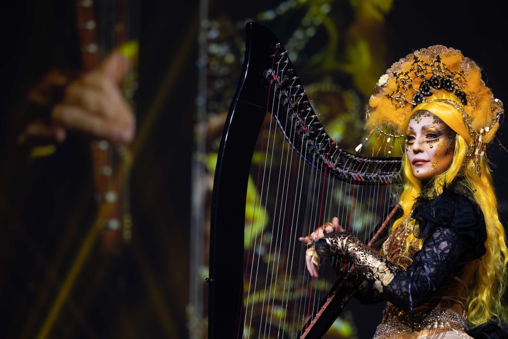 CIMMTL23-GalaGeneral-20230501-602A9753 Ornately made up harpist at event