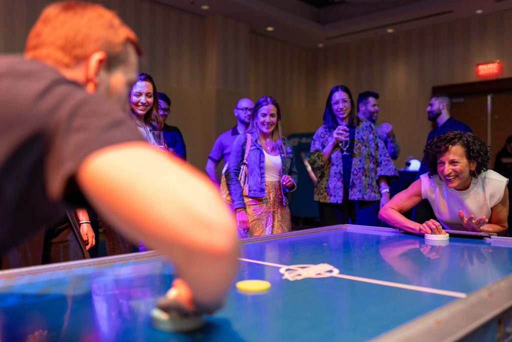 Brother24-NatCon - Credit Julian Haber-20240508-AA8A6809 More action shots at the air hockey table by event photographer, Julian Haber in Montreal