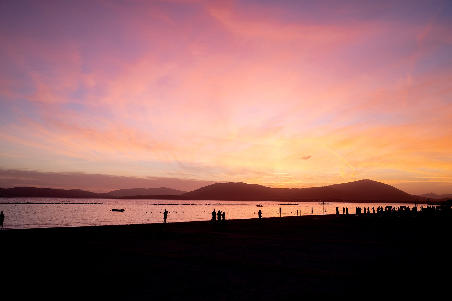 CREDIT Julian Haber-DSCF0363-20240703 Silhouettes on in a beach composition at sunset.