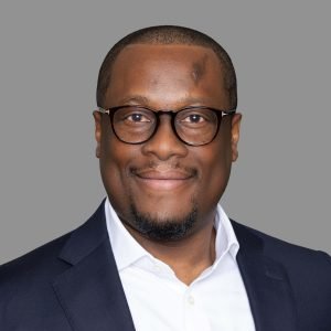 CREDIT Julian Haber- Portrait Styles20231123-602A0528-Edit Professional Black man, classic portrait against neutral grey seamless backdrop.