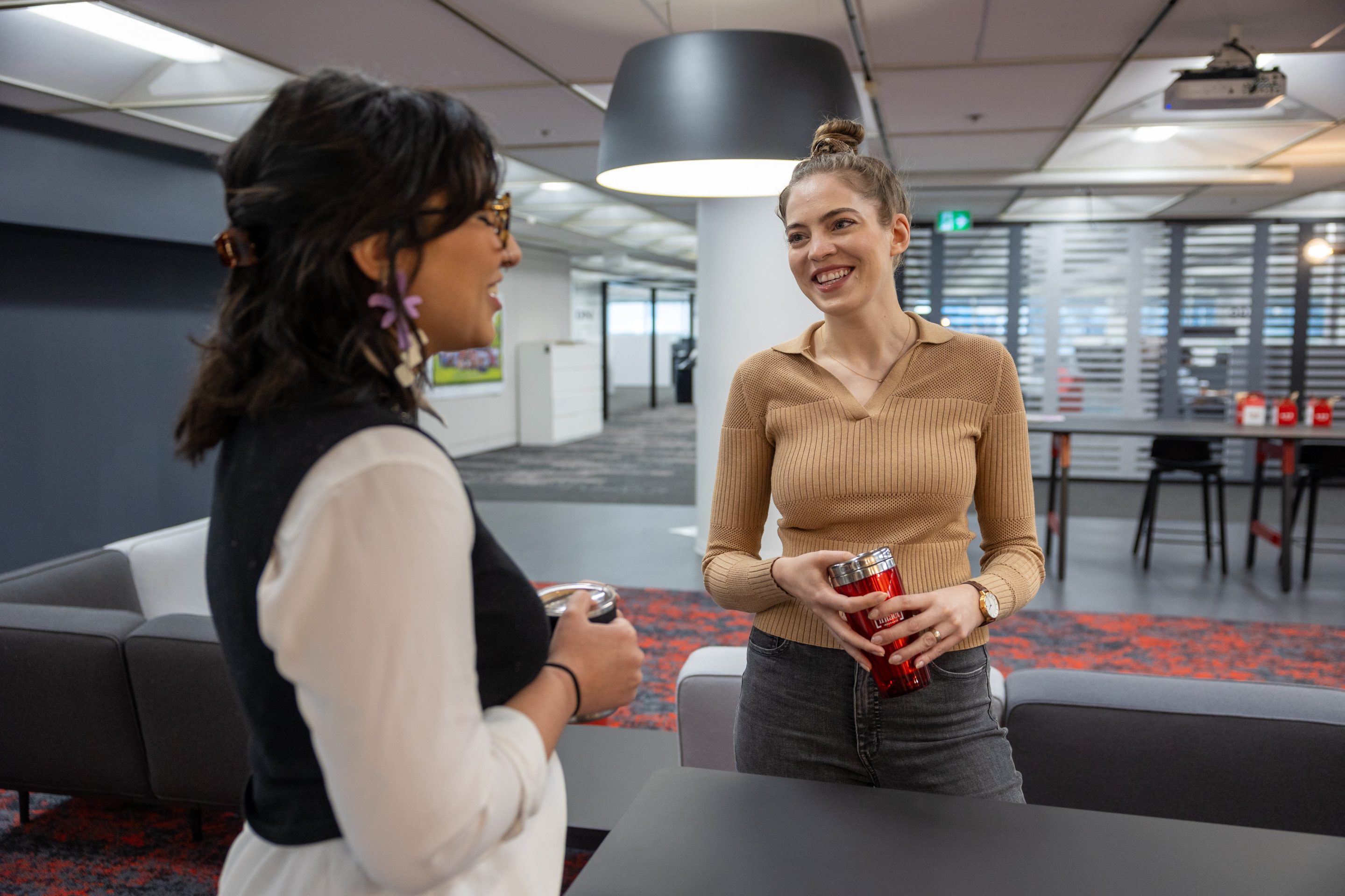 20230907-AA8A4514 Employer Branding: Two women coworkers catching up at Intact Insurance Montreal by Julian Haber