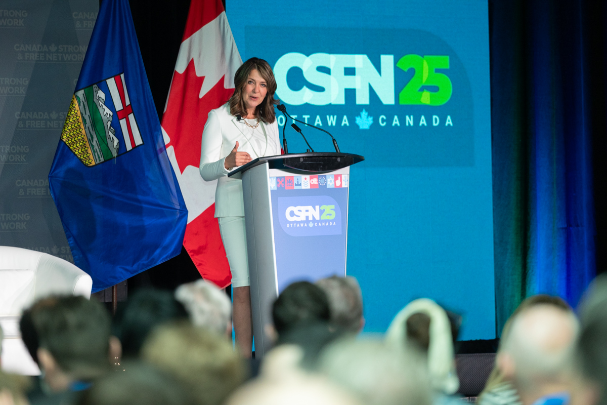 julian-haber-csfn-Premier-Danielle-Smith-keynote-speaker-podium-conference-ottawa Keynote speaker Premier Danielle Smith addressing the audience at the Canada Strong and Free Network (CSFN) 2025 conference in Ottawa — Julian Habe