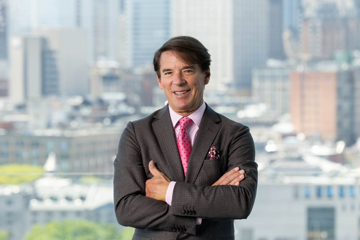 julian-haber-yves-lalumiere-ceo-tourisme-montreal-portrait Professional portrait of Yves Lalumière, President and CEO of Tourisme Montréal, with city skyline — Julian Haber