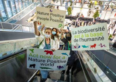 Environmental activists with Nature Positive signs at the UN COP15 summit, Montreal.