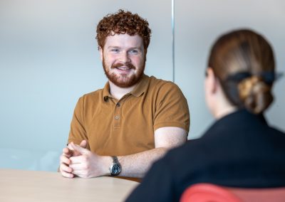 Julian Haber captures an authentic employee mentoring session at Fednav’s Montreal headquarters, highlighting a culture of professional growth and maritime expertise.