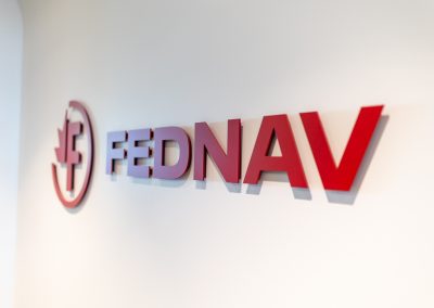 Julian Haber captures the Fednav corporate logo and branding in their modern Montreal office, illustrating high-end industrial interior design.