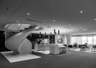 Architectural corporate photography by Julian Haber showing the open-concept lounge and modern furniture at Fednav Montreal.