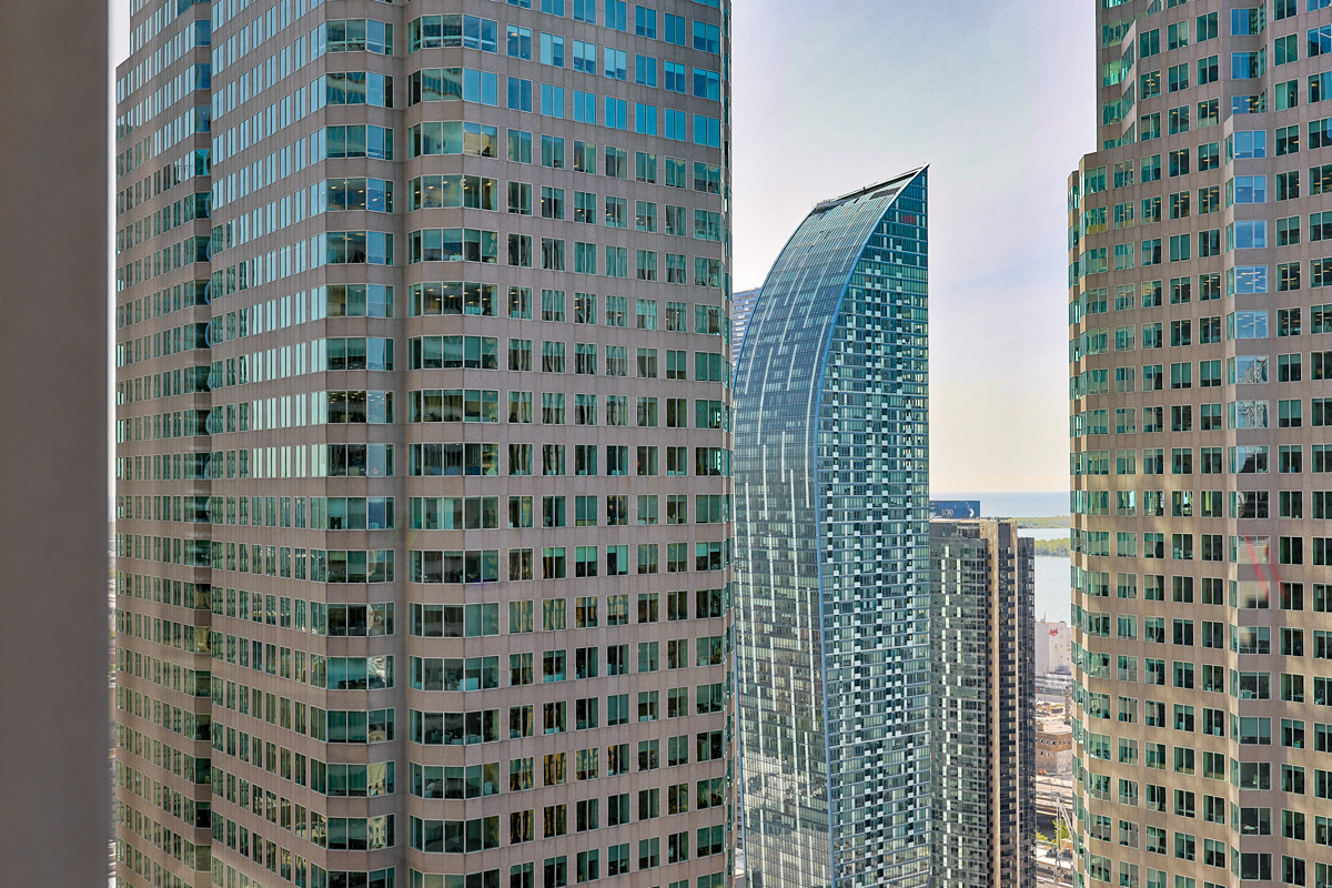 julian-haber-photography-employer-branding-montreal-41 High-angle landscape photography of the urban centre city skyline and skyscrapers from a high-rise office window by Julian Haber