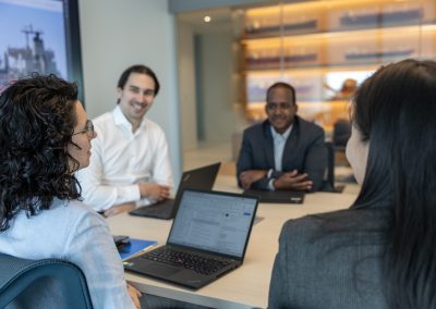 Julian Haber documents a team of professionals in a meeting at Fednav Montreal, highlighting authentic teamwork and corporate leadership.