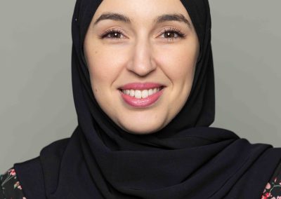 Corporate headshot of Intact Insurance employee wearing a black hijab.