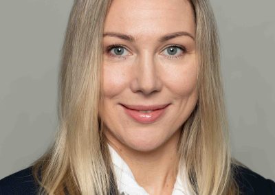 Corporate portrait of Intact Insurance staff member - female professional in white.