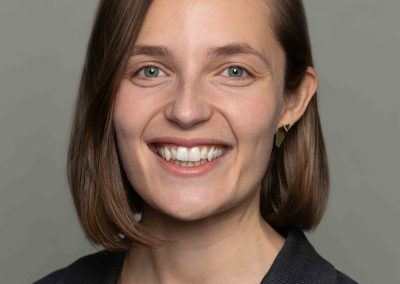 Corporate portrait of Intact Insurance staff member - female professional in blue blazer.