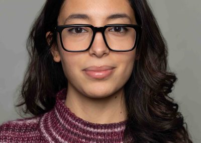 Corporate portrait of Intact Insurance employee -woman wearing high collared sweater, by Julian Haber