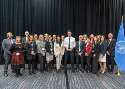 Wide group shot featuring delegates and PM Justin Trudeau at UN COP 15, photo by Julian Haber